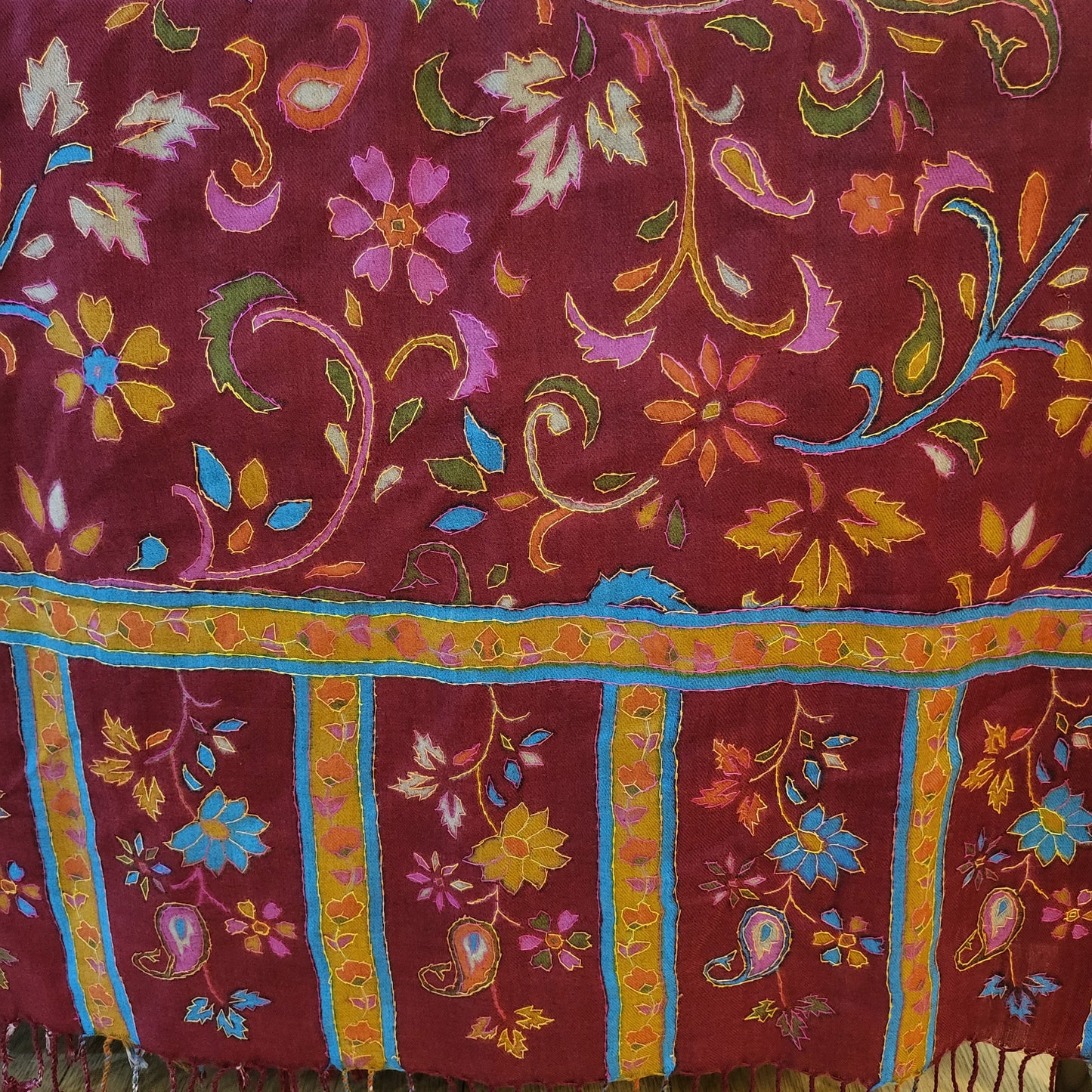 A Kashmiri Semi Pashmina shawl handwoven to a perfect precision, is enriched with the art of Kalamkari which transforms this masterpiece